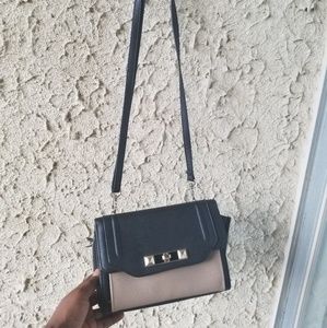Hand bag crossbody or shoulder bag.